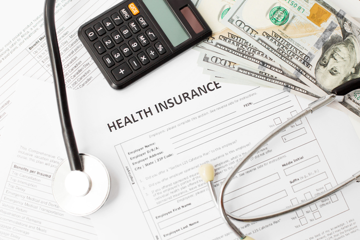 Health insurance application form with banknote and stethoscope concept for life planning