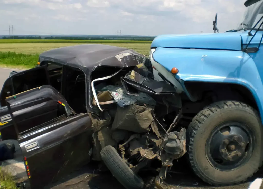 Severe damage from a two-vehicle head-on crash with a car and truck