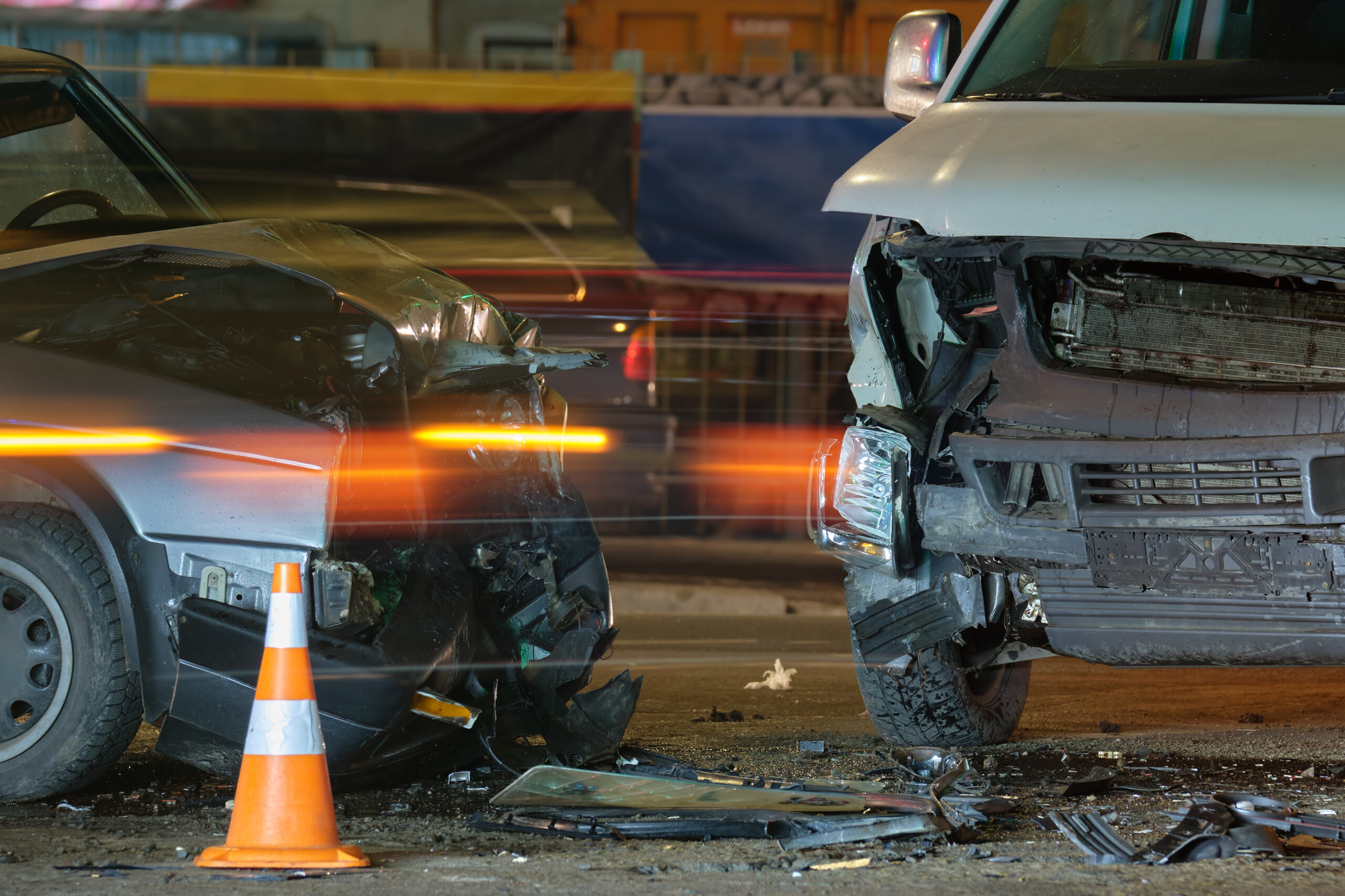 A man assists an injured woman on the roadside after a wrong-way crash on U.S. 421 in Wilkesboro, leaving one dead and another injured.